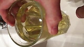 Golden urinate in a guzzling glass