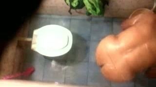 Hidden cam in the toilet room catches Indian milf wife