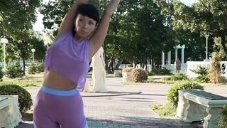Big-chested mummy exercising in watch through sportsuit - flashing